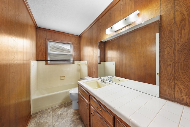 1804 Posey Ln, Sulphur Springs, TX 75482 - bathroom with toilet, a bathtub, vanity, and wooden walls
