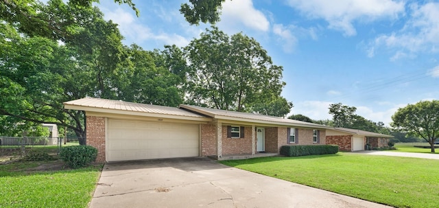 1804 Posey Ln, Sulphur Springs, TX 75482 - ranch-style house with a garage, concrete driveway, brick siding, and metal roof