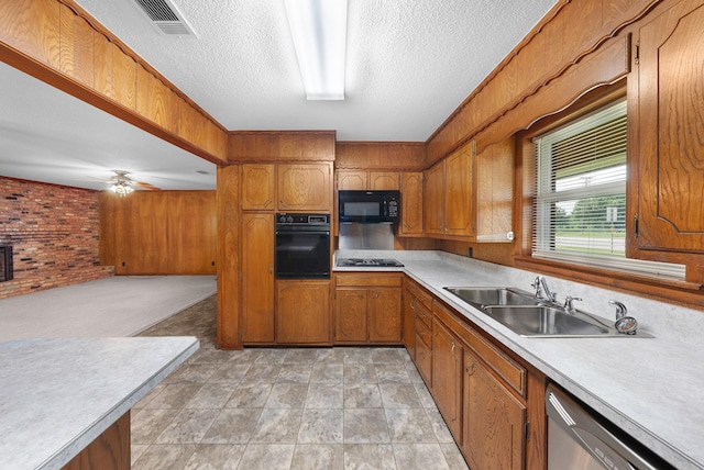 1804 Posey Ln, Sulphur Springs, TX 75482 - kitchen featuring black appliances, a sink, brown cabinets, light countertops, and a textured ceiling