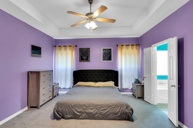 107 Oak Hollow Ln, Red Oak, TX 75154 - bedroom featuring light colored carpet, a raised ceiling, and baseboards