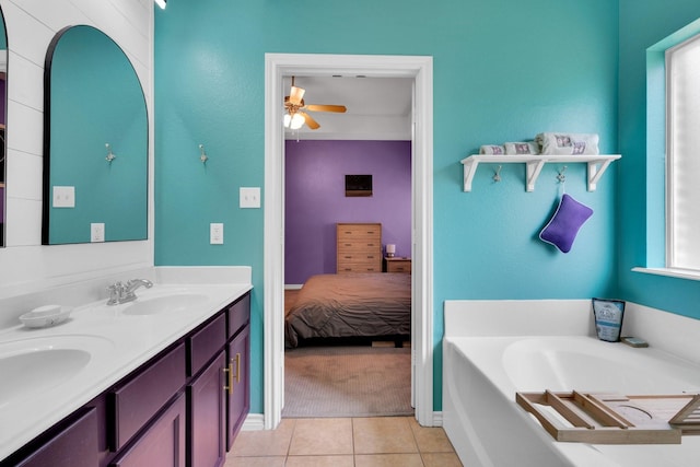 107 Oak Hollow Ln, Red Oak, TX 75154 - bathroom with ceiling fan, double vanity, tile patterned flooring, a garden tub, and ensuite bath