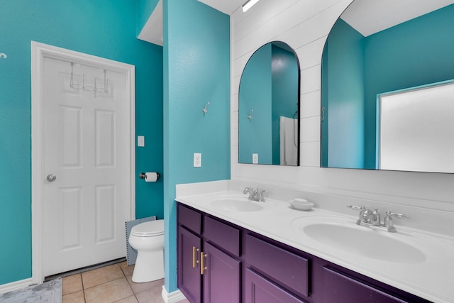 107 Oak Hollow Ln, Red Oak, TX 75154 - bathroom featuring toilet, double vanity, and tile patterned floors