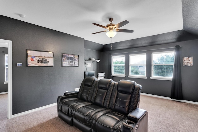 107 Oak Hollow Ln, Red Oak, TX 75154 - carpeted home theater with a ceiling fan, baseboards, and a textured wall
