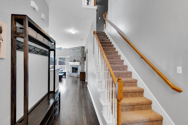 107 Oak Hollow Ln, Red Oak, TX 75154 - stairway with a stone fireplace and wood finished floors