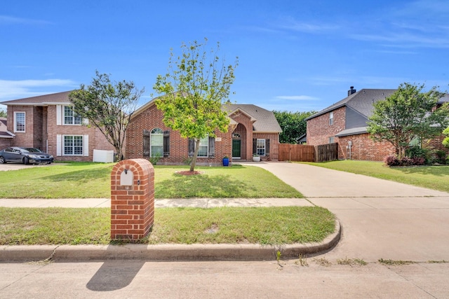 107 Oak Hollow Ln, Red Oak, TX 75154 - traditional-style house featuring concrete driveway and brick siding