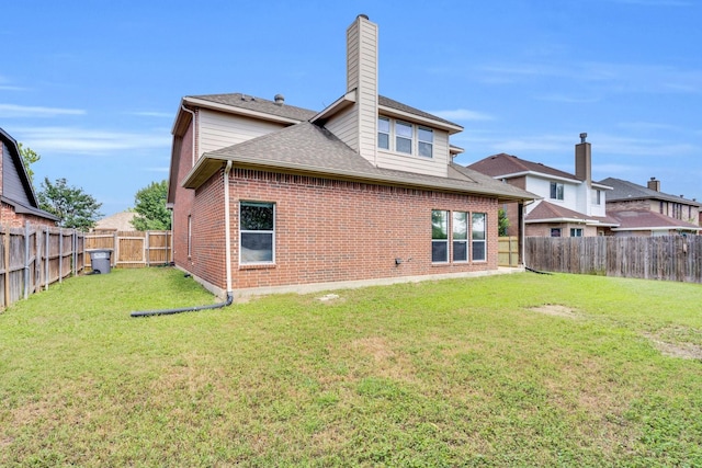 107 Oak Hollow Ln, Red Oak, TX 75154 - back of house featuring a chimney, brick siding, and roof with shingles