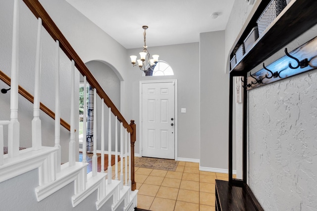 107 Oak Hollow Ln, Red Oak, TX 75154 - foyer with a chandelier, stairway, and light tile patterned floors