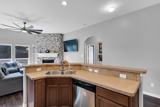 107 Oak Hollow Ln, Red Oak, TX 75154 - kitchen with stainless steel dishwasher, open floor plan, a sink, and a fireplace