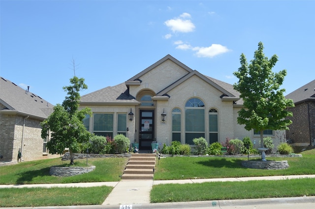 516 Whetstone St, Desoto, TX 75115 - french country inspired facade featuring brick siding and a front lawn