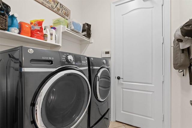 12341 Payne St, Frisco, TX 75033 - washroom with separate washer and dryer and light tile patterned floors