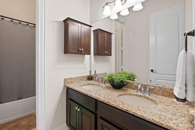 12341 Payne St, Frisco, TX 75033 - full bathroom with double vanity and shower / bath combination with curtain