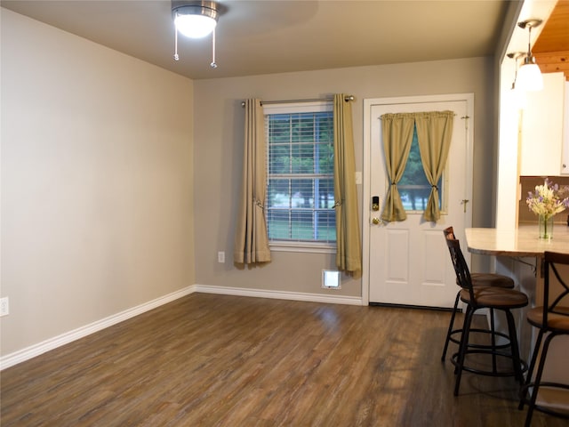 2226 Bethany Rd, Sherman, TX 75090 - dining space featuring baseboards, dark wood-style flooring, and ceiling fan