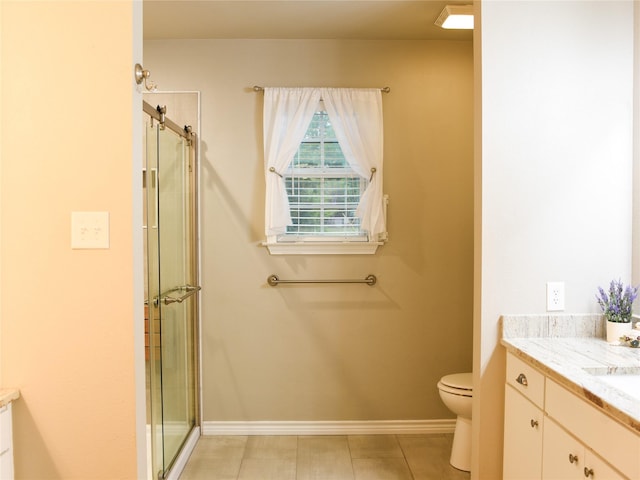 2226 Bethany Rd, Sherman, TX 75090 - full bath with vanity, toilet, an enclosed shower, and baseboards