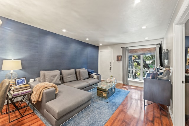 5055 Cedar Springs Rd Unit 242, Dallas, TX 75235 - living room with an accent wall, recessed lighting, wood-type flooring, and baseboards