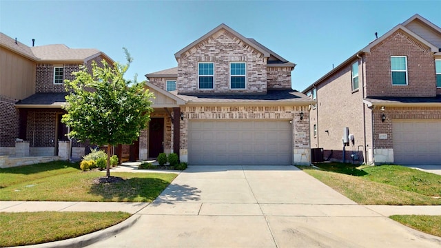 2753 Henson Ln, Garland, TX 75040 - view of front of house with a garage, driveway, a front yard, and brick siding