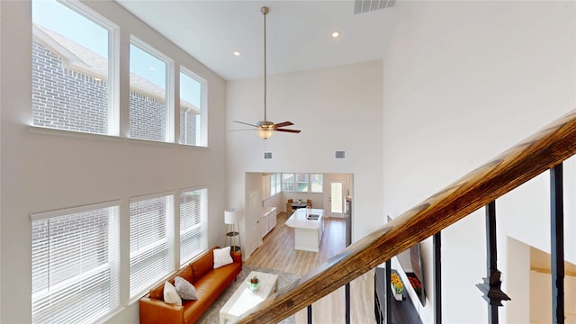 2753 Henson Ln, Garland, TX 75040 - living area with plenty of natural light, a towering ceiling, a ceiling fan, and recessed lighting