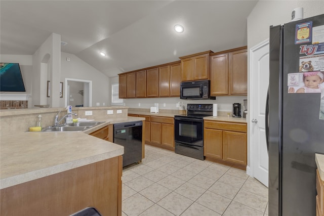 408 Prescott Ln, Fort Worth, TX 76036 - kitchen featuring black appliances, a sink, lofted ceiling, light countertops, and light tile patterned flooring