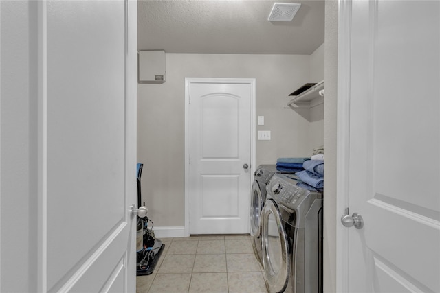 408 Prescott Ln, Fort Worth, TX 76036 - laundry area with independent washer and dryer, light tile patterned flooring, and baseboards