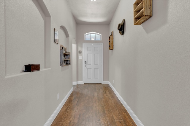 408 Prescott Ln, Fort Worth, TX 76036 - entryway with dark wood finished floors, arched walkways, and baseboards