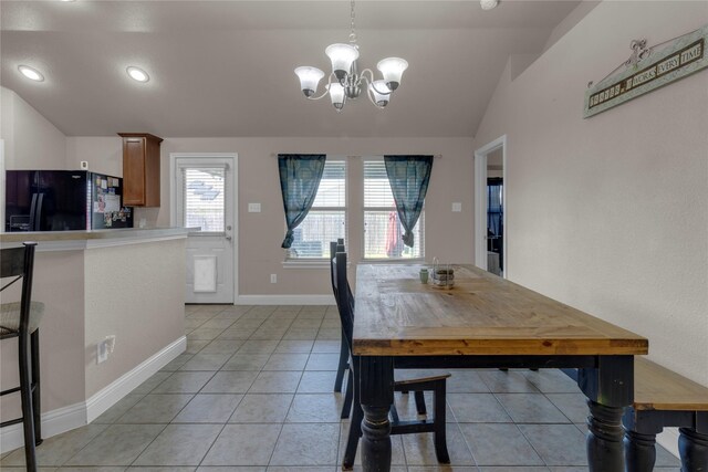 408 Prescott Ln, Fort Worth, TX 76036 - dining room with lofted ceiling, a chandelier, light tile patterned flooring, and baseboards