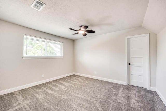 3414 Janlyn Ln, Farmers Branch, TX 75234 - carpeted empty room with a textured ceiling, a ceiling fan, vaulted ceiling, and baseboards