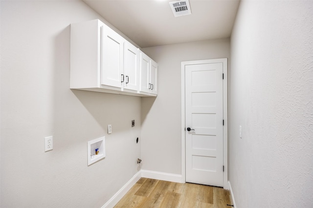 3414 Janlyn Ln, Farmers Branch, TX 75234 - laundry room with electric dryer hookup, light wood-type flooring, baseboards, cabinet space, and washer hookup