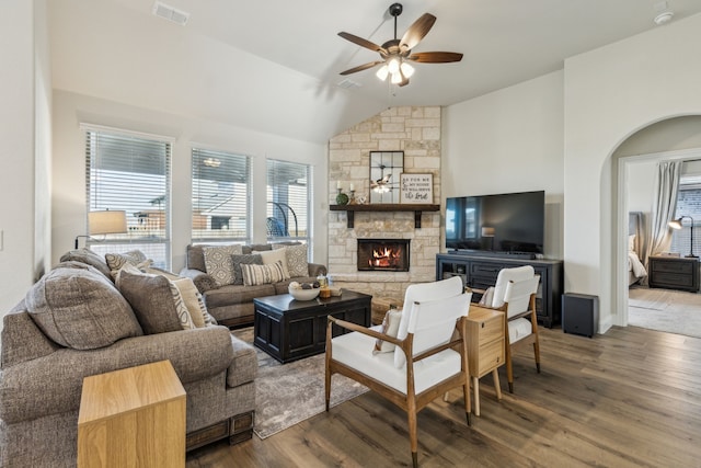 233 Lakewood Ln, Ponder, TX 76259 - living room featuring ceiling fan, lofted ceiling, wood finished floors, a fireplace, and arched walkways