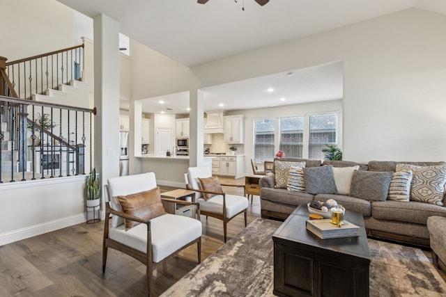 233 Lakewood Ln, Ponder, TX 76259 - living area featuring dark wood finished floors, a ceiling fan, stairway, vaulted ceiling, and baseboards