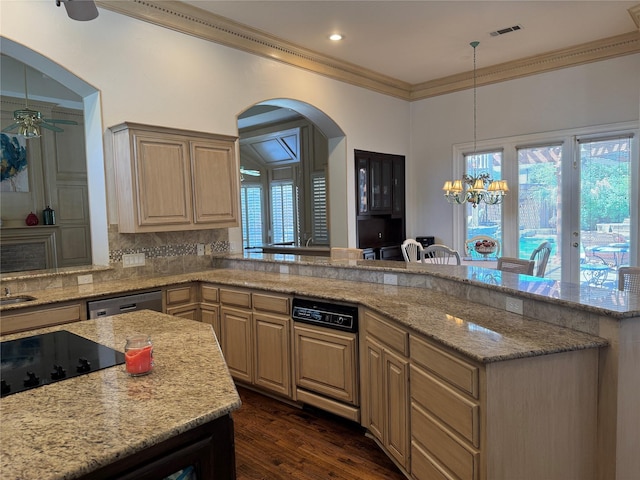 5812 Braemar Dr, Plano, TX 75093 - kitchen with arched walkways, ceiling fan, ornamental molding, a peninsula, and decorative backsplash
