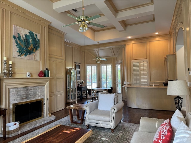 5812 Braemar Dr, Plano, TX 75093 - living room with ceiling fan, a decorative wall, coffered ceiling, wood finished floors, and beamed ceiling