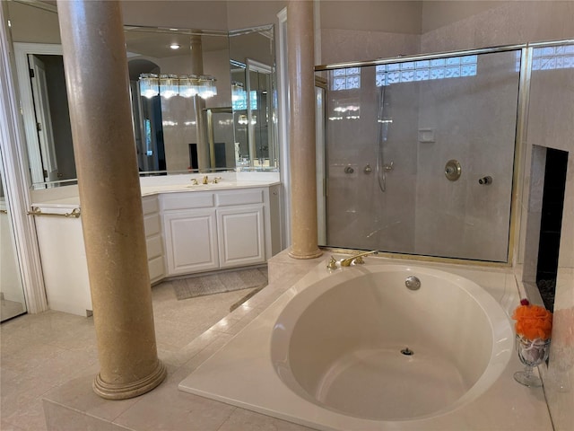 5812 Braemar Dr, Plano, TX 75093 - full bath featuring ornate columns, a garden tub, vanity, and an enclosed shower