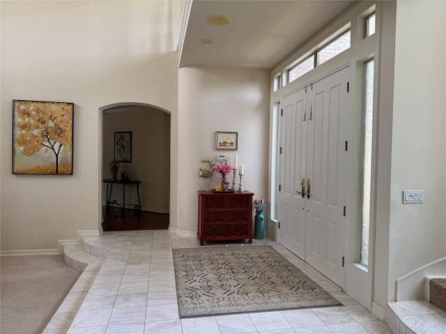 5812 Braemar Dr, Plano, TX 75093 - foyer entrance with arched walkways and baseboards