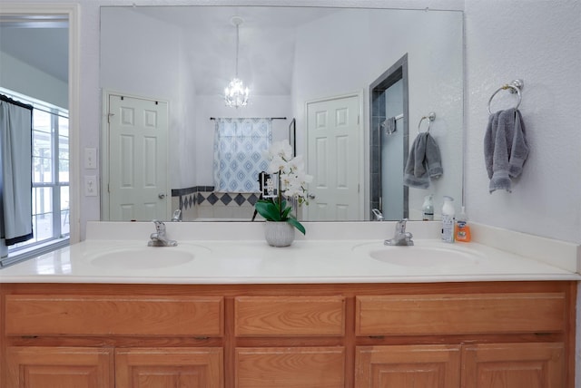 320 Mockingbird Ln, Springtown, TX 76082 - bathroom with double vanity, a chandelier, and a shower