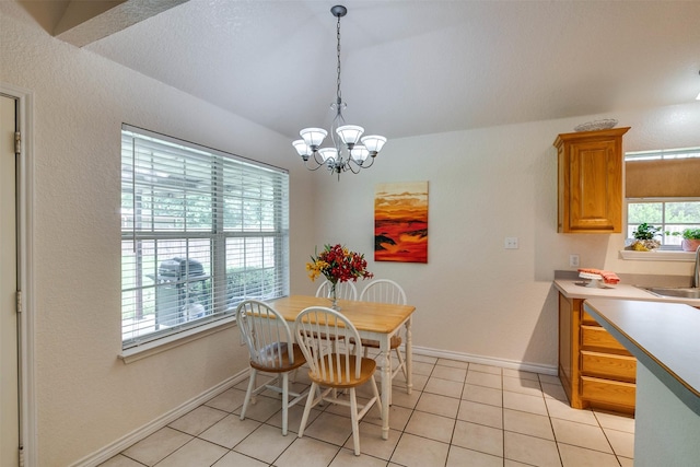 320 Mockingbird Ln, Springtown, TX 76082 - dining room with a chandelier, baseboards, light tile patterned flooring, and vaulted ceiling