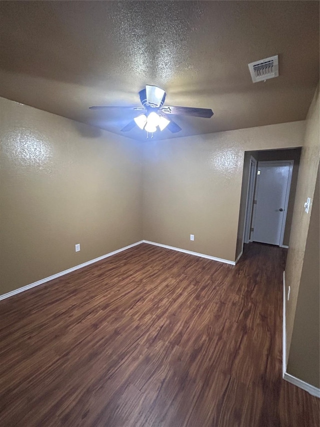 10058 Marblehead Ct, Fort Worth, TX 76108 - unfurnished room featuring dark wood-style floors, ceiling fan, baseboards, and a textured ceiling