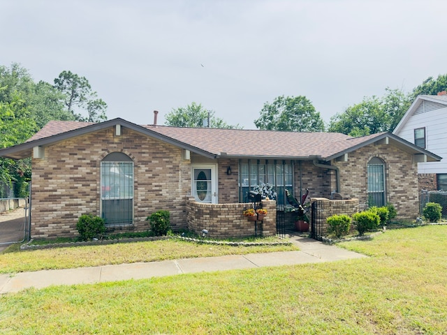 2616 Avenida Loop, Irving, TX 75062 - view of front of property with brick siding and roof with shingles