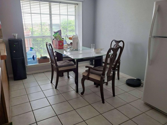 2616 Avenida Loop, Irving, TX 75062 - dining room featuring plenty of natural light, baseboards, and light tile patterned flooring