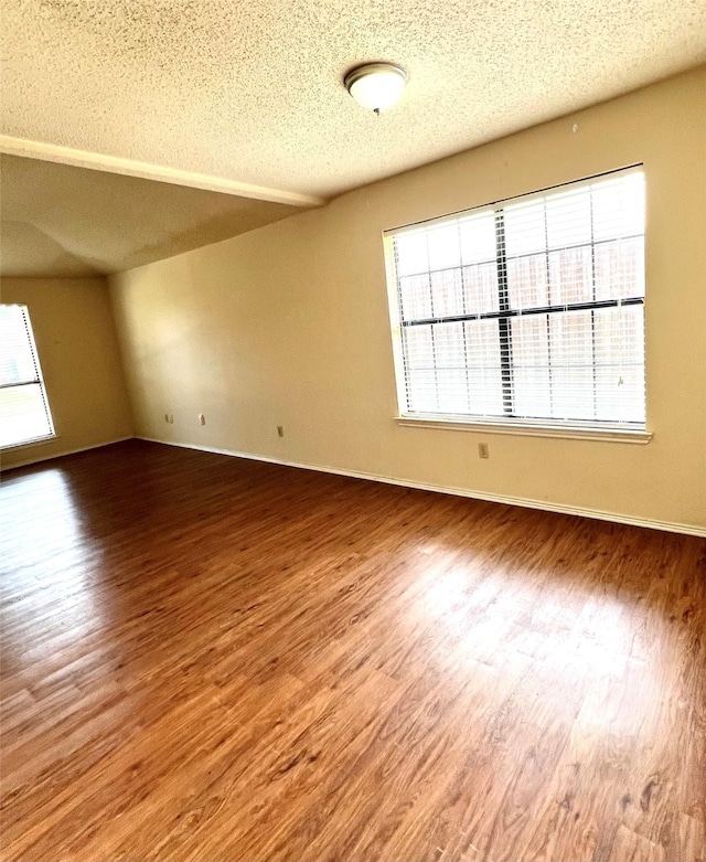 2617 Independence Dr, Mesquite, TX 75150 - unfurnished room featuring wood finished floors, a textured ceiling, and baseboards