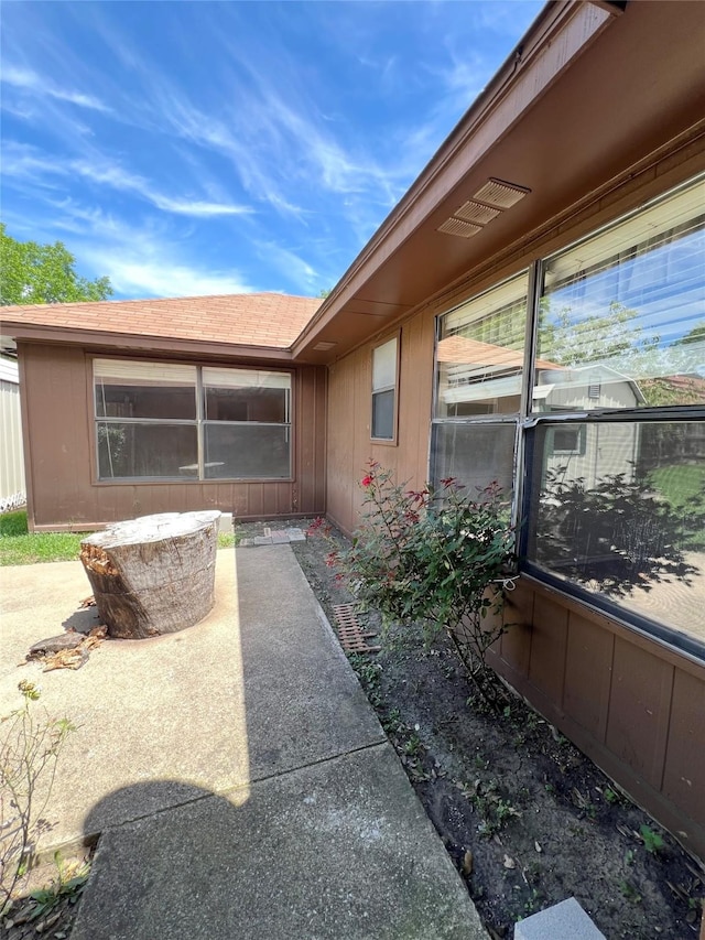 2617 Independence Dr, Mesquite, TX 75150 - view of home's exterior with a patio area and roof with shingles