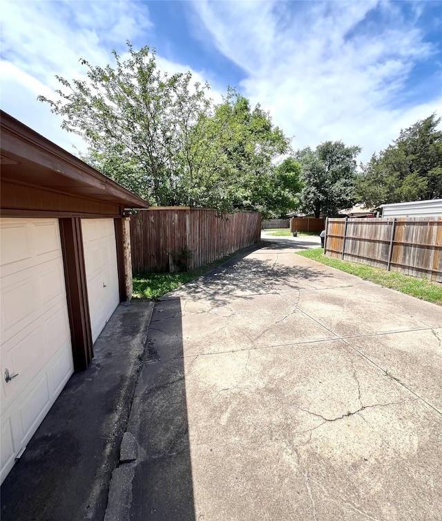 2617 Independence Dr, Mesquite, TX 75150 - view of patio with driveway and a garage