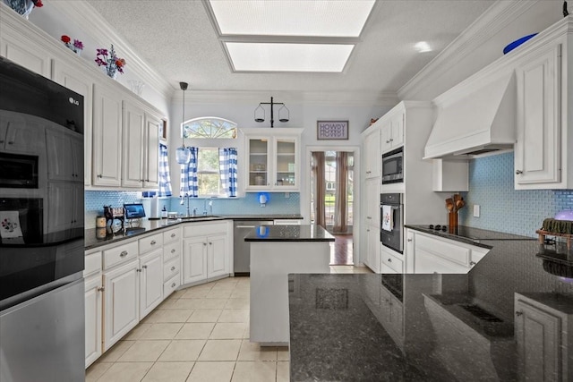 9505 Lost Trails Dr, Waco, TX 76712 - kitchen with stainless steel appliances, custom range hood, decorative backsplash, a sink, and crown molding