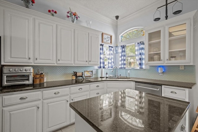 9505 Lost Trails Dr, Waco, TX 76712 - kitchen featuring a sink, stainless steel dishwasher, white cabinetry, backsplash, and a textured ceiling