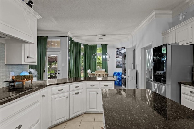 9505 Lost Trails Dr, Waco, TX 76712 - kitchen featuring stainless steel refrigerator with ice dispenser, custom exhaust hood, white cabinetry, tasteful backsplash, and a textured ceiling
