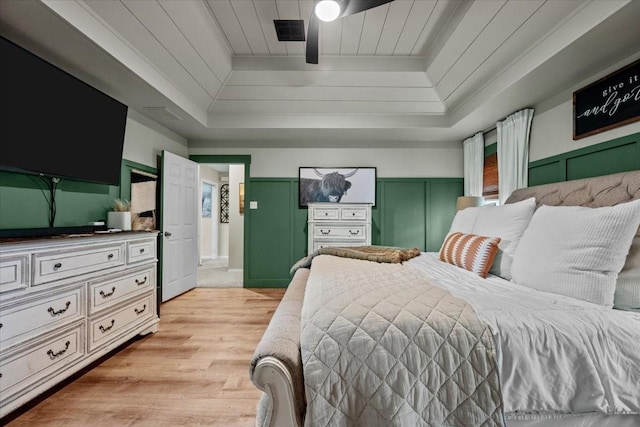 9505 Lost Trails Dr, Waco, TX 76712 - bedroom featuring a tray ceiling, light wood-style flooring, and crown molding