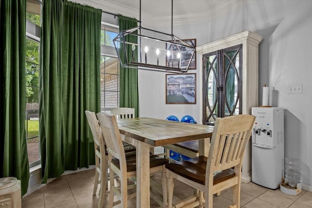 9505 Lost Trails Dr, Waco, TX 76712 - dining area with a chandelier, light tile patterned floors, and crown molding