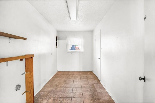 880 S Fm 779, Emory, TX 75440 - empty room with a textured ceiling, baseboards, and stone finish flooring
