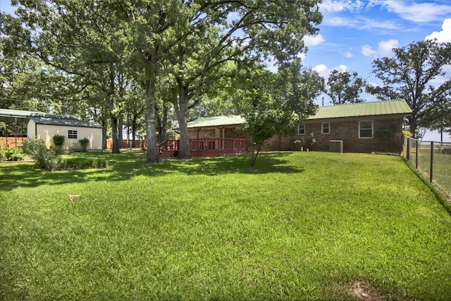 880 S Fm 779, Emory, TX 75440 - view of yard featuring central AC, an outdoor structure, and a wooden deck