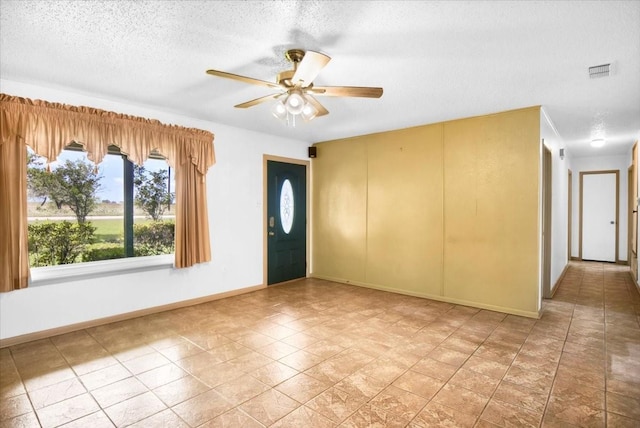 880 S Fm 779, Emory, TX 75440 - entryway featuring baseboards, ceiling fan, and a textured ceiling