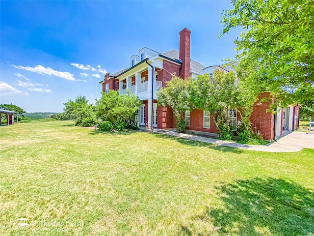 3226 County Road 360, Merkel, TX 79536 - view of front of property featuring brick siding, a front yard, and a chimney