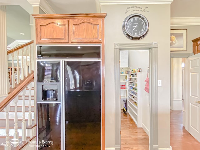 3226 County Road 360, Merkel, TX 79536 - kitchen featuring refrigerator with ice dispenser, light wood-style floors, and ornamental molding